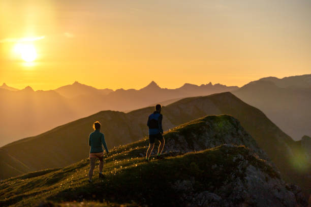 istock Trail runners ascend high mountain ridge 1257854335