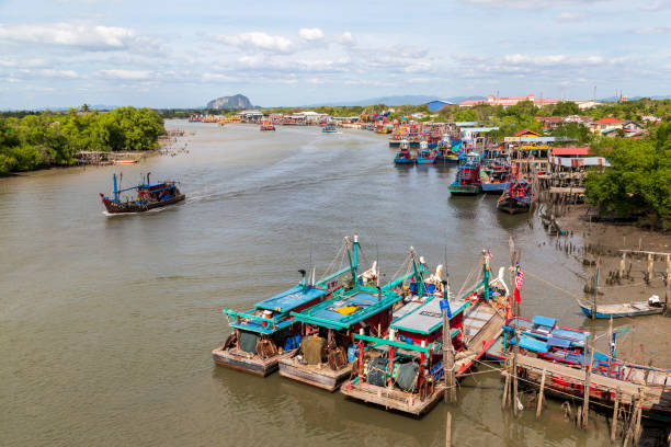 Kuala Kedah, Malaysia - January 9, 2020: View of the Kedah River fishing boats and Kuala Kedah a mukim and parliamentary constituency in Kota Setar District, Kedah, Malaysia. It is a fishing port, located at the mouth of the Kedah River.