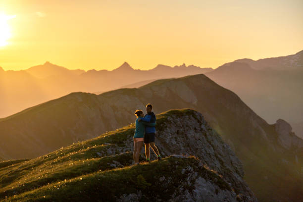 istock Trail runners ascend high mountain ridge 1257856109