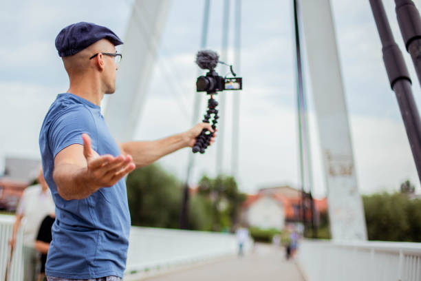 istock Vlogger is recording his new vlog 1257856903