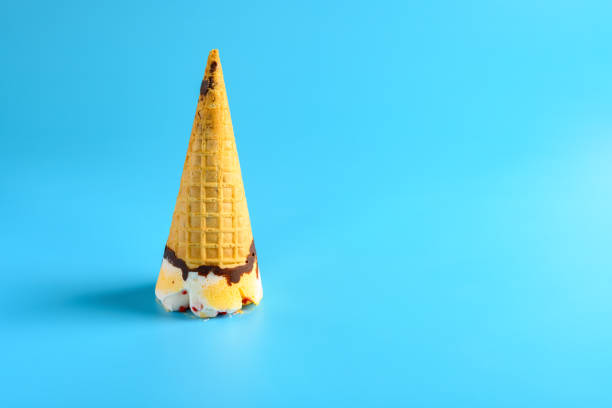 istock pineapple and cherry flavor ice cream cone stands upside down on a blue background 1257861796