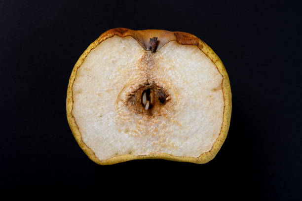 istock cut out section of an overripe pear on black background 1257862584