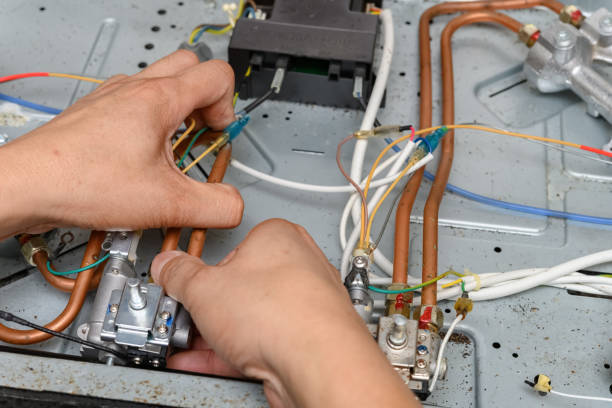 istock man fixing a gas cooker 1257863362