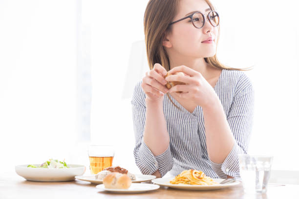 istock asian woman who eats 1257866323
