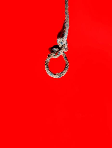 istock Rope knot on red background. decorative concept 1257879746