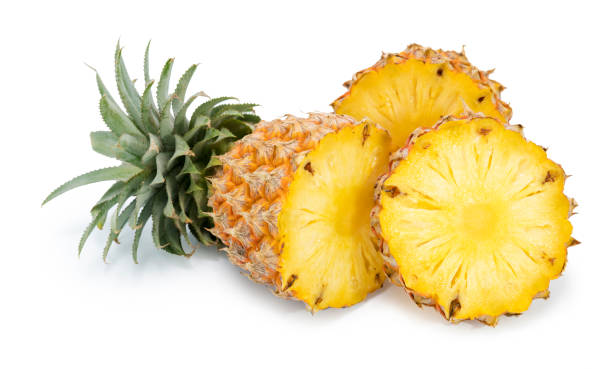 istock Fresh pineapple with slices isolated on white 1257884930