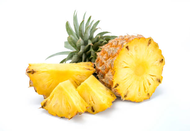istock Fresh pineapple with slices isolated on white 1257884958