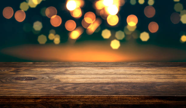 istock Empty wooden table top with beautiful light bokeh background for product showing. 1257889946
