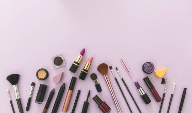 Make up cosmetics products against pastel purple background