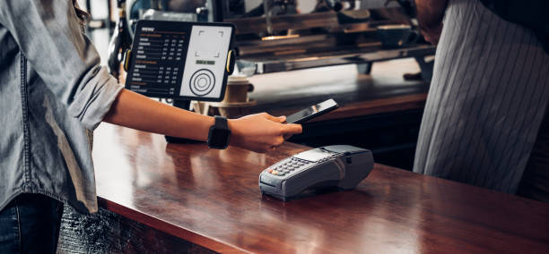 customer contactless payment for drink with mobile phon at cafe counter bar,seller coffee shop accept payment by mobile.new normal lifestyle concept customer contactless payment for drink with mobile phon at cafe counter bar,seller coffee shop accept payment by mobile.new normal lifestyle concept kiosk photos stock pictures, royalty-free photos & images