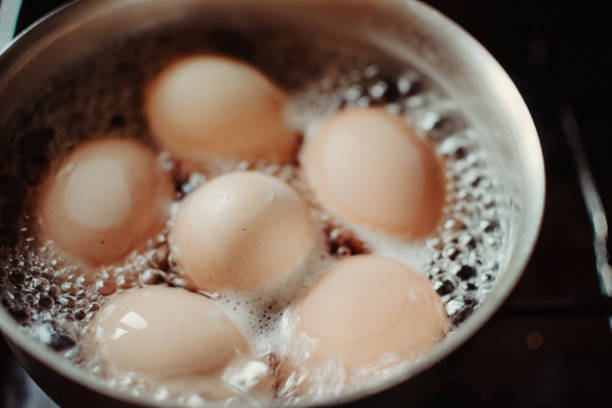 istock Eggs are boiling with high temperature. Cooking chicken eggs in pot. Boiled eggs. 1257898959