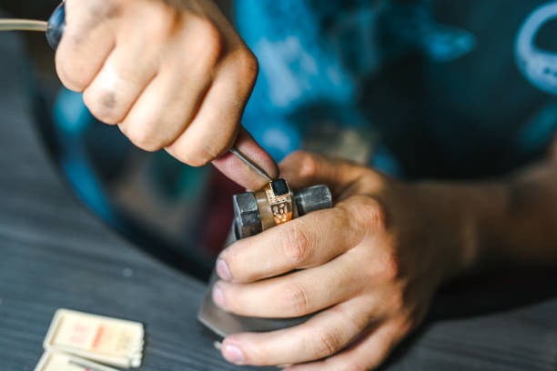 istock Master goldsmith while working on jewelry on the of work table. 1257910138