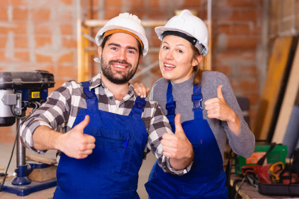 istock Portrait of two successful workers in uniform inside brick cottage 1257912629