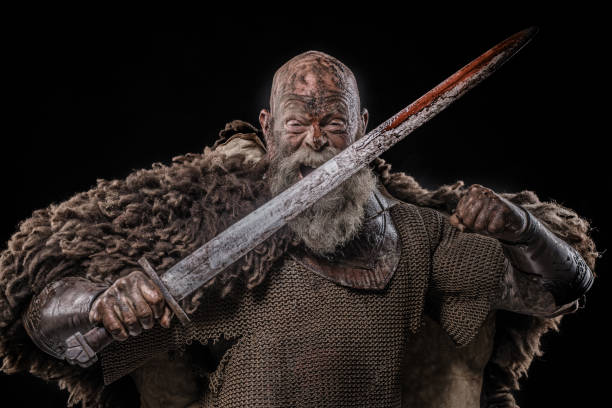 istock Weapon wielding bloody senior viking warrior in studio shot 1257912771