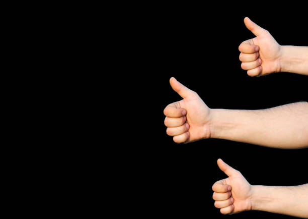 istock Hands with thumbs up. Like sign. Isolated on black background. 1257913127