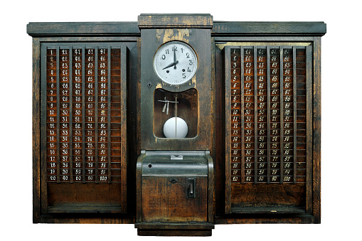 Antique wooden time clock / vintage punch clock, device that records start and end times for hourly employees against white background