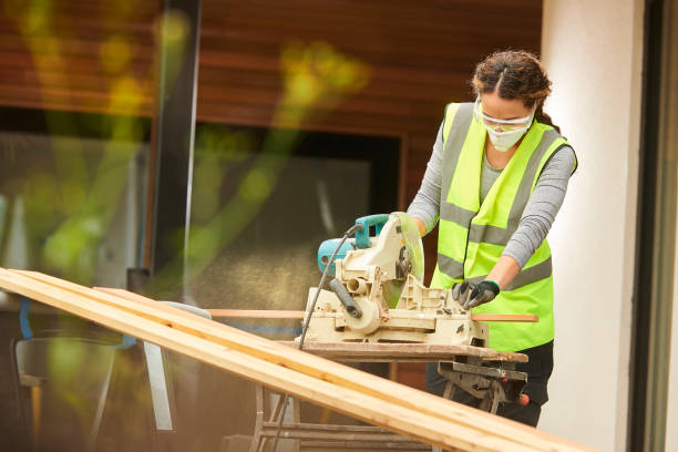 istock female carpenter with circular saw 1257918278
