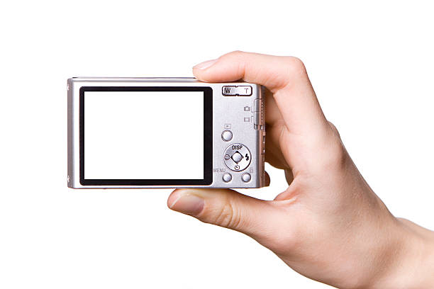 istock Isolated image of hand holding digital camera 125791904