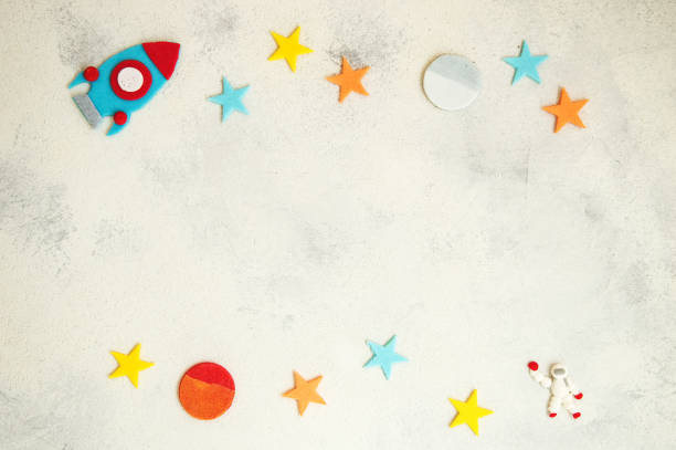 istock Close up. A drawing on a space theme was laid out from sweets. Blue rocket astronaut and multicolored stars. Copy space. 1257919648