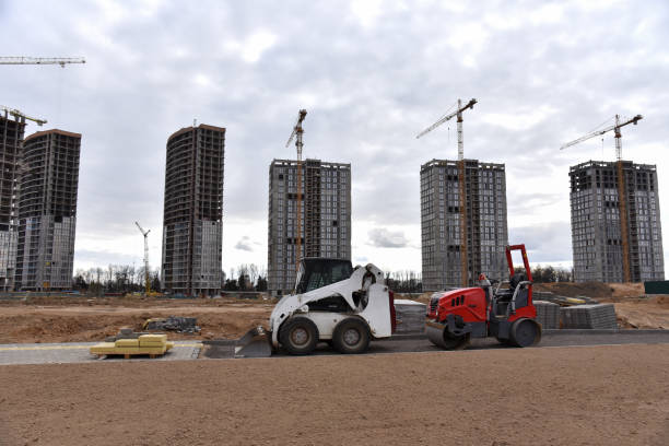 istock Bobcat skid-steer loader and mini road roller during laying paving slabs. Paving roller machine for asphalt pavement. ompact construction equipment for roadwork in limited conditions 1257919866