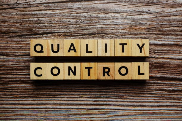 istock Quality Control alphabet letter on wooden background 1257920222