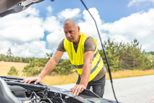 istock Stressed man having trouble with his broken car 1257921307