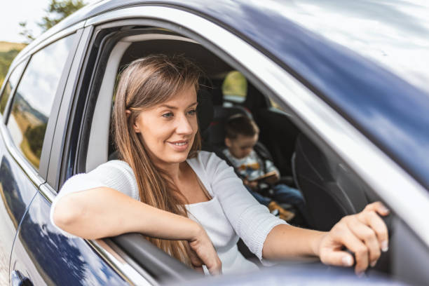 istock Woman in Car with Little Boy 1257921437
