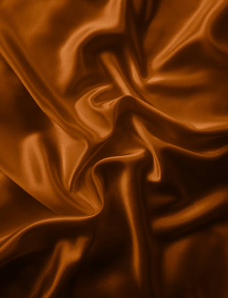 istock Beautiful elegant wavy brown satin silk. 1257922202