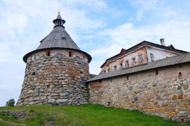 istock Ancient monastery tower and fragment of wall 1257922794