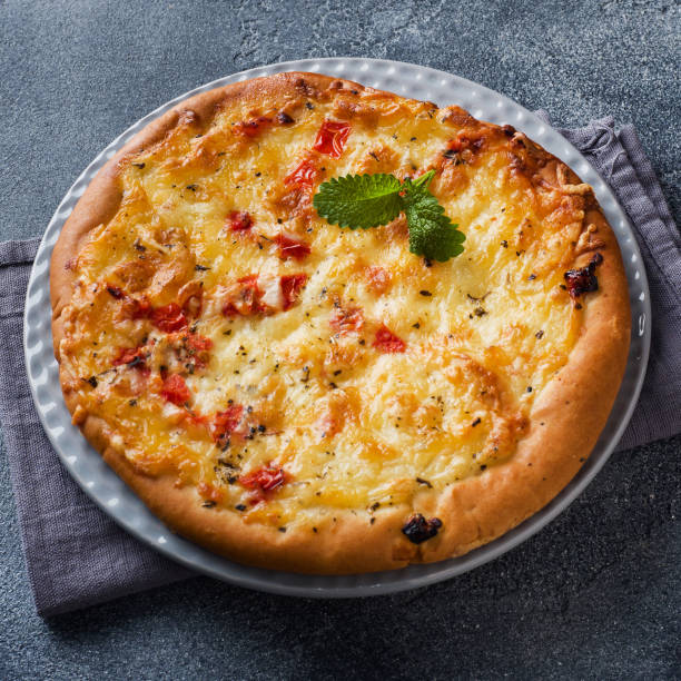 istock Baked flatbread with cheese and sauce. Homemade pizza. 1257923535