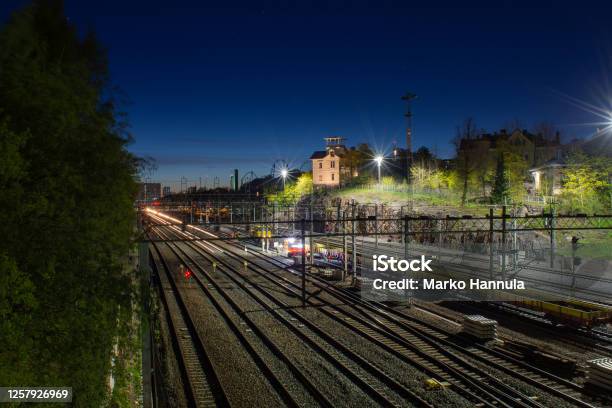 A Railroad Junction During Night Time Stock Photo - Download Image Now - Shunting Yard, Aerial View, Architecture