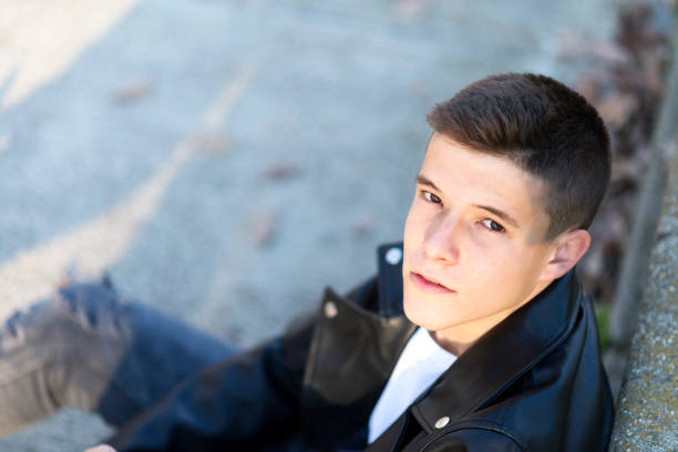 istock Attractive blond young man shot from above, looking up 1257930378