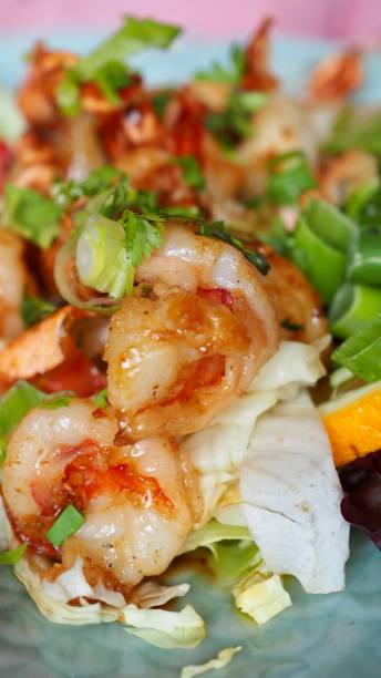 istock Grilled tiger prawns with salad 1257930828
