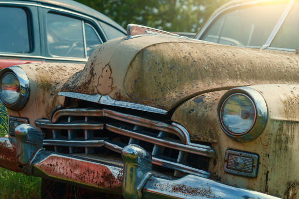 istock Old rusty retro vintage car with peeling paint close up, abandoned auto 1257931484