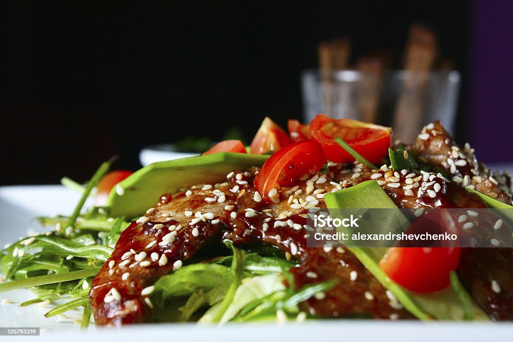 Warm salad with beef Warm salad with veal. Tasty and nutritious food Arugula Stock Photo