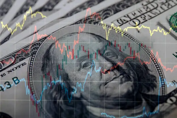 Photo of Financial Data Analysis Graph Over One Hundred American Dollar Bill