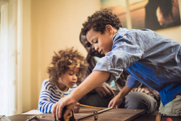 istock Helping father assembling furniture with kids 1257933582