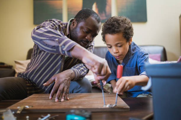 istock Helping father assembling furniture with kids 1257933594