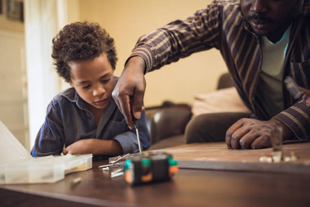 istock Helping father assembling furniture with kids 1257933613