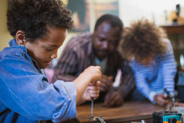 istock Helping father assembling furniture with kids 1257933615