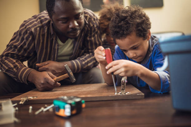 istock Helping father assembling furniture with kids 1257933623
