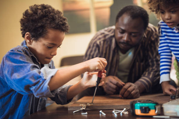 istock Helping father assembling furniture with kids 1257933631