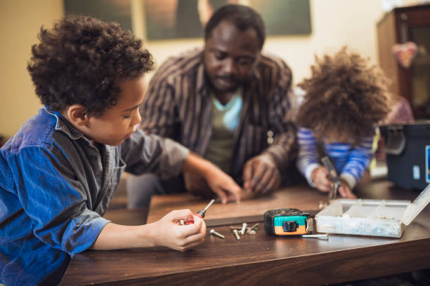 istock Helping father assembling furniture with kids 1257933725