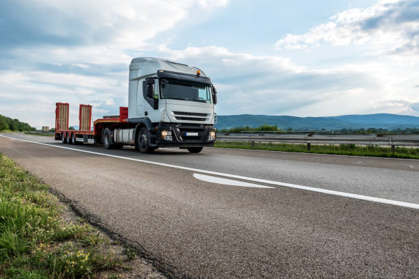 istock Semi trailer truck on a highway at sunset 1257933883