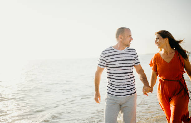 istock The couple enjoy their holiday at sunset 1257937006