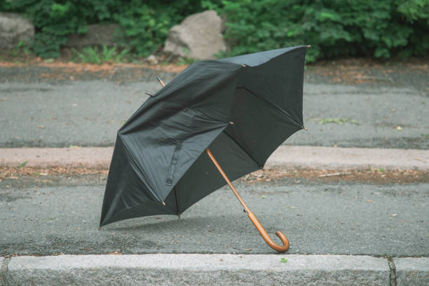 istock Broken umbrella left behind on the street. 1257939624