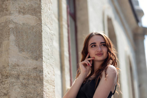 istock Charming red-haired girl in the Park posing for the camera 1257940453