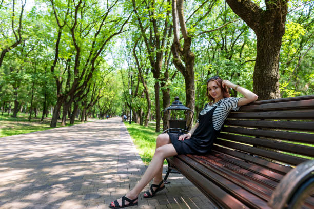 istock Charming red-haired girl in the Park posing for the camera 1257940545