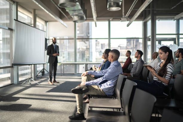 istock Business people attending a seminar with social distancing 1257943039