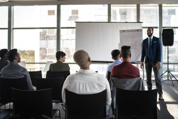 istock Business people attending a seminar with social distancing 1257943049